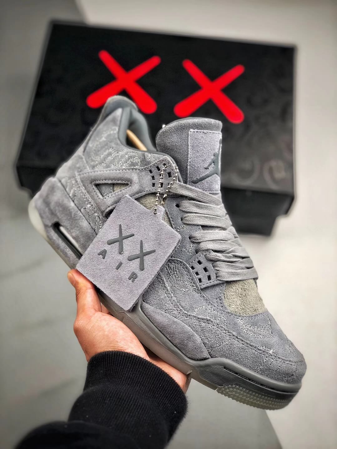 The KAWS x Air Jordan 4 Retro Cool Grey 