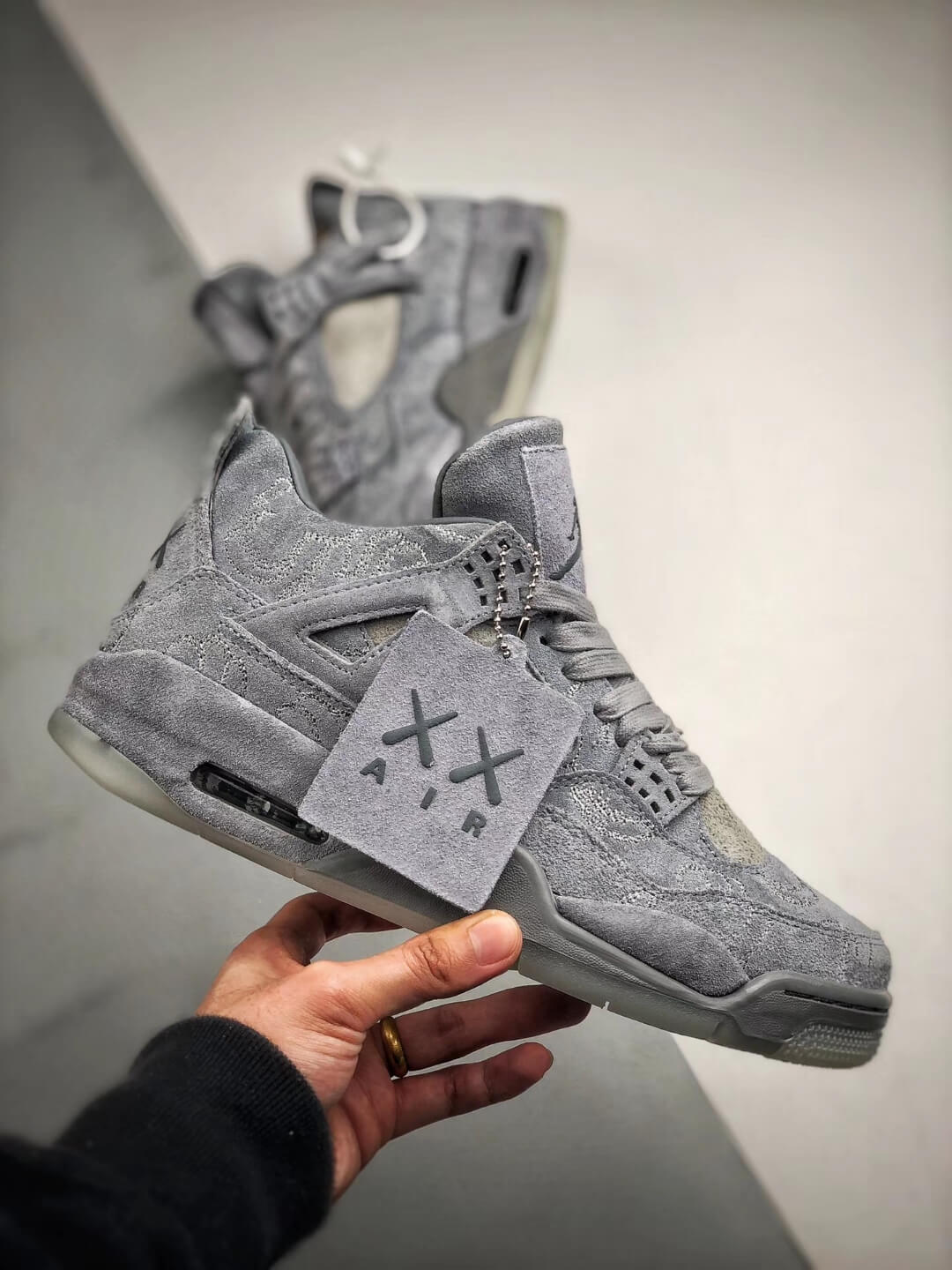 The KAWS x Air Jordan 4 Retro Cool Grey 